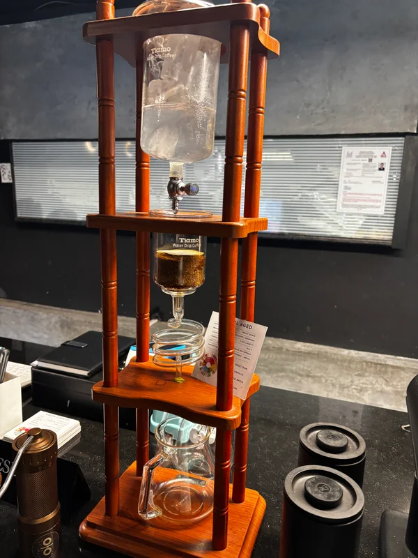 A wooden cold-drip coffee tower